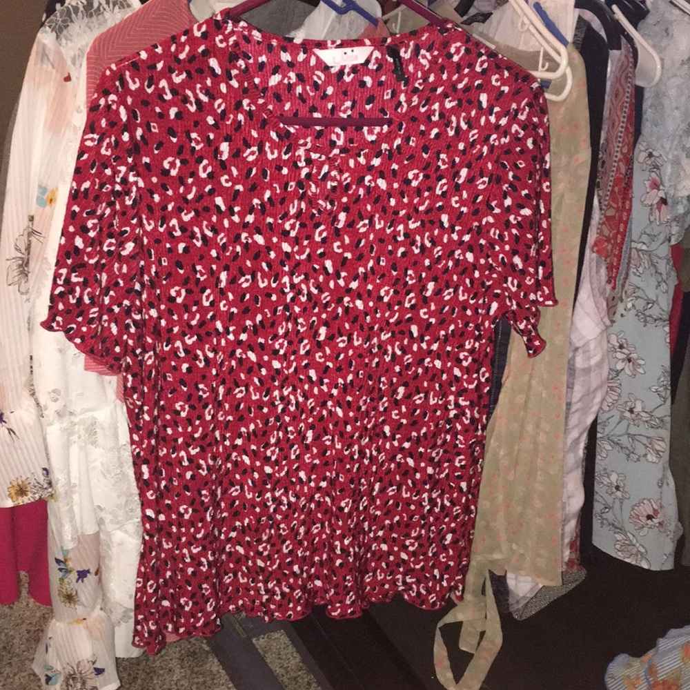 Red blouse with black and white designs